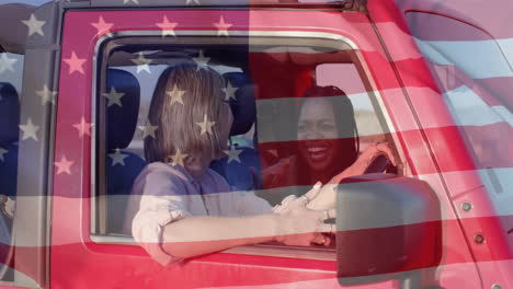 Animation-of-flag-of-usa-over-happy-diverse-women-in-car-by-beach-in-summer
