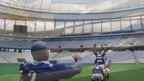 Animation-Der-Flagge-Uruguays-über-Einem-Afroamerikanischen-Rugbyspieler,-Der-Seiner-Mannschaft-Im-Stadion-Einen-Ball-Zuwirft