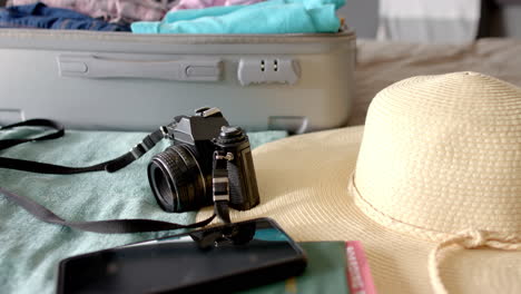 Mature-woman-not-visible,-but-her-belongings-suggest-preparing-for-trip