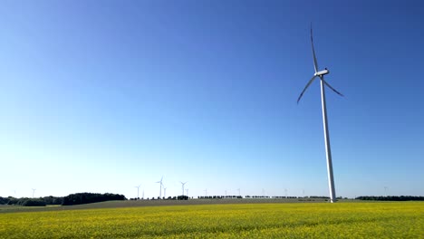 View-of-a-wind-turbine-and-many-others-in-the-background,-renewable-energy-sources