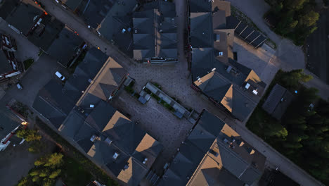 Top-down-drone-shot-above-buildings-in-the-Levi-town,-summer-sunset-in-Finland