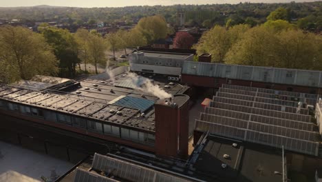 Drone-shot-of-industrial-heating-chimney-steam