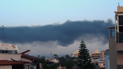 Time-lapse-of-a-thick-black-smoke,-after-a-missile-attack-in-Israel,-wildfire-burn,-4k-video