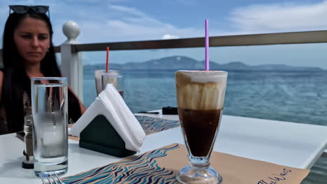 Iced-Coffee-Served-at-a-Seaside-Cafe-on-a-Dinner-Date