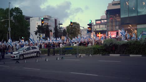Editorial-Haifa,-Israel---05-25-2024:-People-with-signs-calling-for-elections-now-and-hostage-deal,-protest-march-near-Horev-center-Haifa,-Israel