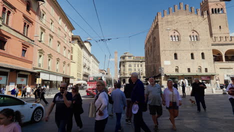 Bustling-street-scene-in-Bologna-with-historic-architecture-and-tram