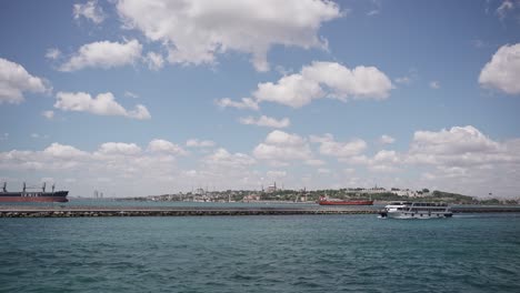 Ships,-ferries,-boats,-historical-buildings-in-the-Bosphorus,-Istanbul,-Turkiye