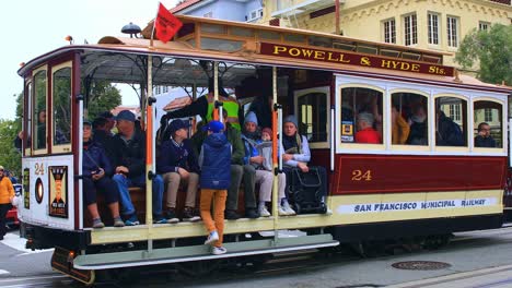 Tourists-Wait-on-a-Tram-or-Trolley-in-San-Francisco-at-an-Intersection-near-Lombard-Street,-Close-Up-Static-Shot