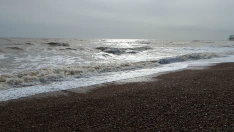 Beautiful-Sun-Reflection-on-Slow-Motion-Waves-on-Brighton-Beach,-UK