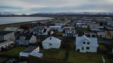 Drone-shot-of-small-town-in-Iceland-during-winter-in-the-morning