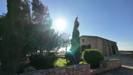 old-stone-building-surrounded-by-greenery-and-trees-in-Pafos,-Cyprus