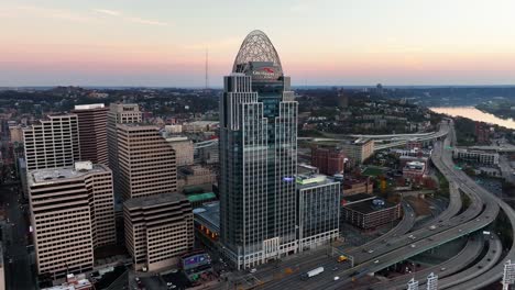 Aerial-view-away-from-the-Great-American-tower,-fall-sunrise-in-Cincinnati,-USA