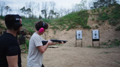 Male-reload-and-shoot-shotgun-with-instructor-supervision,-Olesko-shooting-range