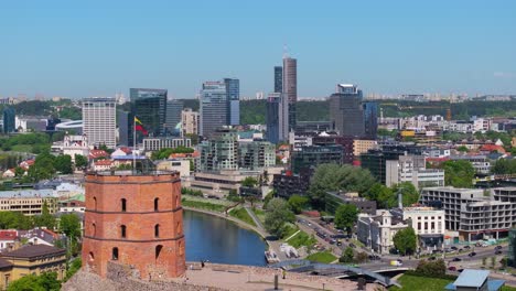 Lithuanian-Flag-at-Gediminas-Tower,-Skyline-View-in-Background