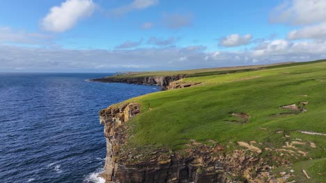 Stunning-Landscape-and-Coastline-of-Scotland-on-Sunny-Day,-Aerial-View-of-Cliffs-and-Green-Pastures