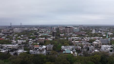 Aerial-wide-descending-shot-of-downtown-Savannah-from-Forsyth-Park-in-Georgia