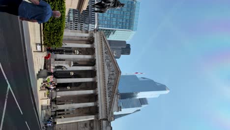 View-of-The-Royal-Exchange,-Bank-of-England,-and-the-London-Troops-War-Memorial-in-England,-contemporary-architectural-aesthetics-amidst-a-dynamic-urban-environment