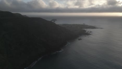 João-bom-trail-and-mosteiros-village-at-sunrise-with-dramatic-coastal-scenery,-aerial-view