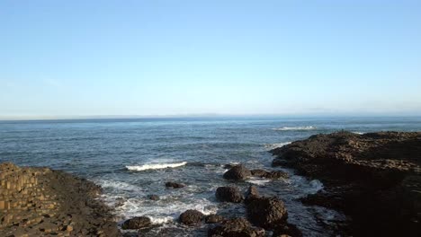 Aerial-shot-of-the-basal-colums-at-Giant's-Causeway-in-County-Antrim,-Northern-Ireland-at-sunrise