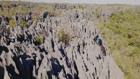 Aerial-drone-view-close-up-of-big-Tsingy-de-Bemaraha---beautiful-rock-formation-in-national-park-in-Madagascar