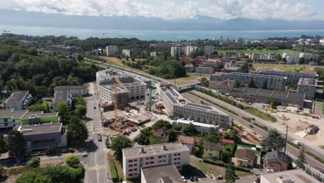 Aerial-of-newly-built-structures-on-a-construction-site-with-a-tall-crane