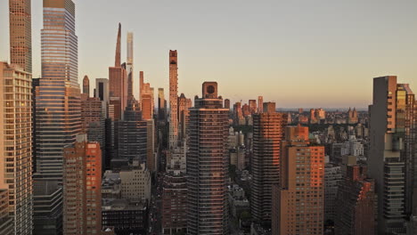 NYC-New-York-Aerial-v366-drone-fly-above-60th-St-capturing-cityscape-of-Midtown-Manhattan-and-Lenox-Hill-overlooking-at-Central-Park-at-sunrise---Shot-with-Mavic-3-Pro-Cine---September-2023