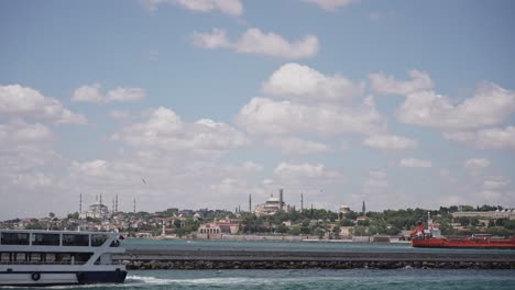 Ships,-ferries,-boats,-historical-buildings-in-the-Bosphorus,-Istanbul,-Turkiye