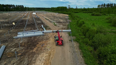 Building-of-a-solar-farm-clean-green-energy-field,-building-of-solar-panel-frames