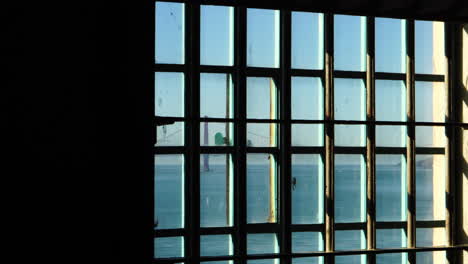 Alcatraz-Prison-Detail,-Metal-Bars-on-Window-With-View-of-Golden-Gate-Bridge-and-San-Francisco-Bay,-California-USA