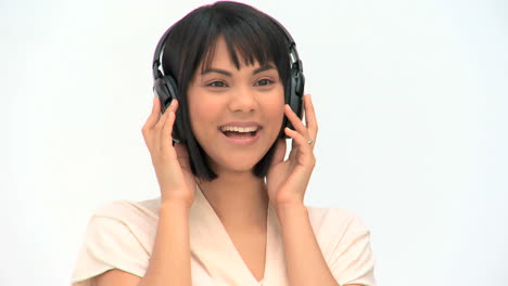 Lovely-asian-woman-listening-to-music-
