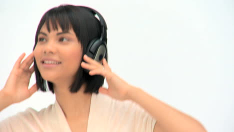 Cute-asian-woman-listening-to-music-