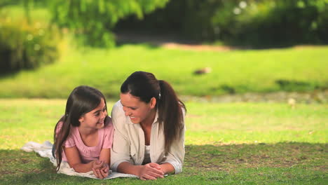 Mother-and-daughter-chatting-outdoors