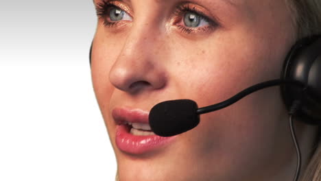 Attractive-Female-talking-and-Smiling-on-a-headset