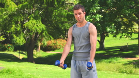 Handsome-male-doing-musculation-exercises-