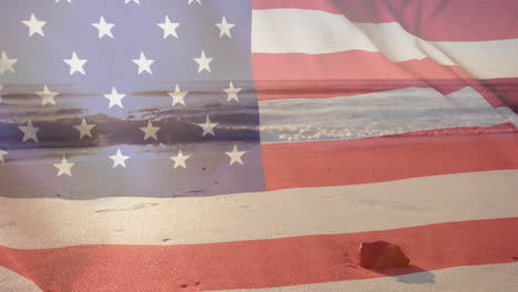 Animation-of-american-flag-over-sea-and-sunny-sand-beach-with-rock