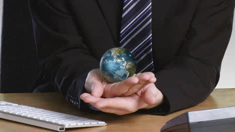 Businessman-with-a-rotary-globe-in-his-hand