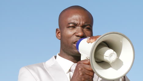 Successful-businessman-giving-briefings-via-megaphone