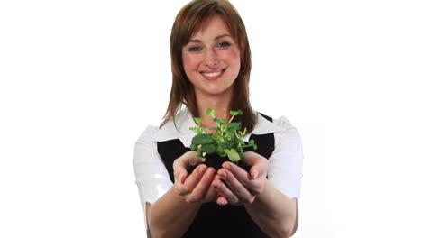 Woman-holding-a-plant