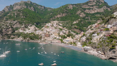 Panoramic-drone-shot-of-Positano-in-Amalfi-coast,-Italy-on-a-sunny-day