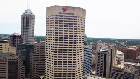 Indianapolis-aerial-view-circling-One-America-downtown-high-rise-skyscraper-in-Indiana-financial-district