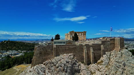 Parthenon-monument-on-Acropolis-mountain-in-Athens,-Greece---rising,-drone-shot