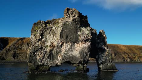 Drone-shot-of-Hvitserkur-rock-formation-on-water-in-Iceland-during-winter4