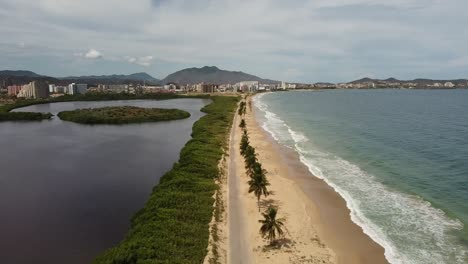 Rising-drone-shot-of-playa-caracola-in-Venezuela-with-Caribbean-Sea-waves