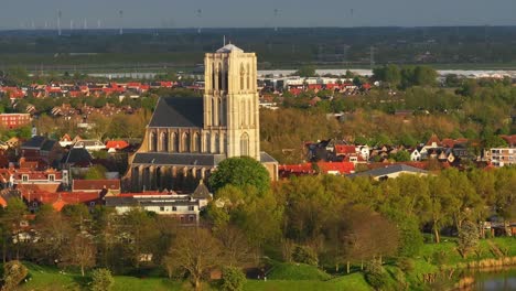 Surrounded-by-nature,-Dutch-architecture,-building-rooftops,-religious-venue