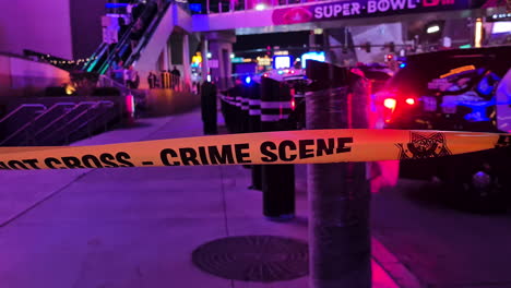 Las-Vegas-USA,-Crime-Scene-Do-Not-Cross-Police-Tape-on-Strip-Sidewalk-at-Night,-Police-and-Emergency-Lights
