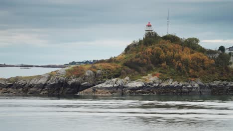 A-miniature-lighthouse-on-the-small-grass-covered-rocky-island