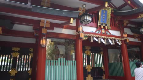 hie-shrine-akasaka,-Hie-Jinja-shrine,-bamboo-fountain,-temple,-Japanese-walking-with-his-bicycle