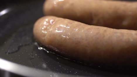 Closeup-shot-of-sauage-cooking-in-pan