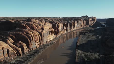 A-river-flows-near-the-rugged-terrain,-the-landscape-near-Moab,-Utah,-south-of-Salt-Lake-City,-USA