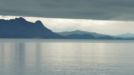 Heavy-stormy-clouds-hang-above-the-mountainous-fjord-shores